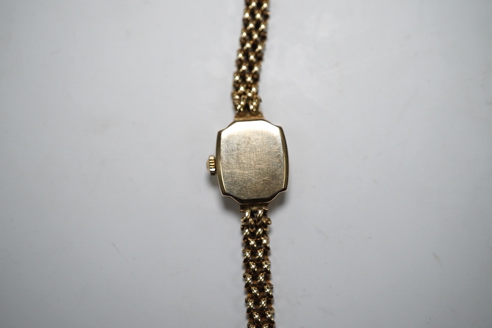 A lady's 9ct gold Accurist manual wind wrist watch, on a 9ct gold bracelet, gross weight 12.3 grams. Condition - fair